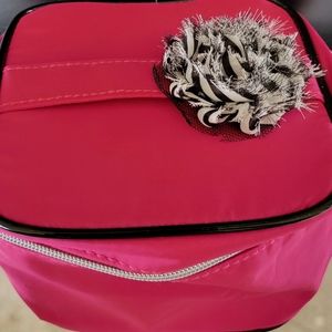 Pink Lancome zippered makeup case.